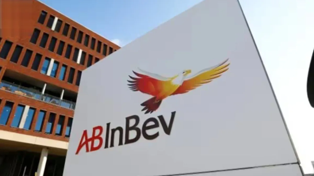 Stack of AB InBev branded beer cans displayed at a local stall, showcasing the brand’s premium packaging
