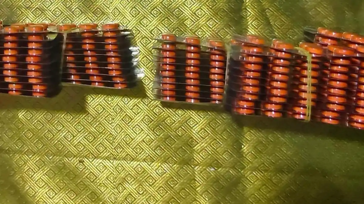 Police officers seizing narcotic tablets in Arakkonam