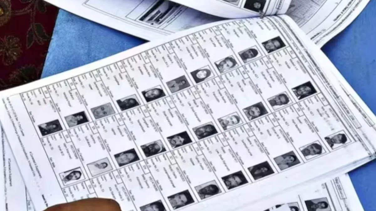 Delhi Congress workers inspecting voter list at a booth in Chandni Chowk