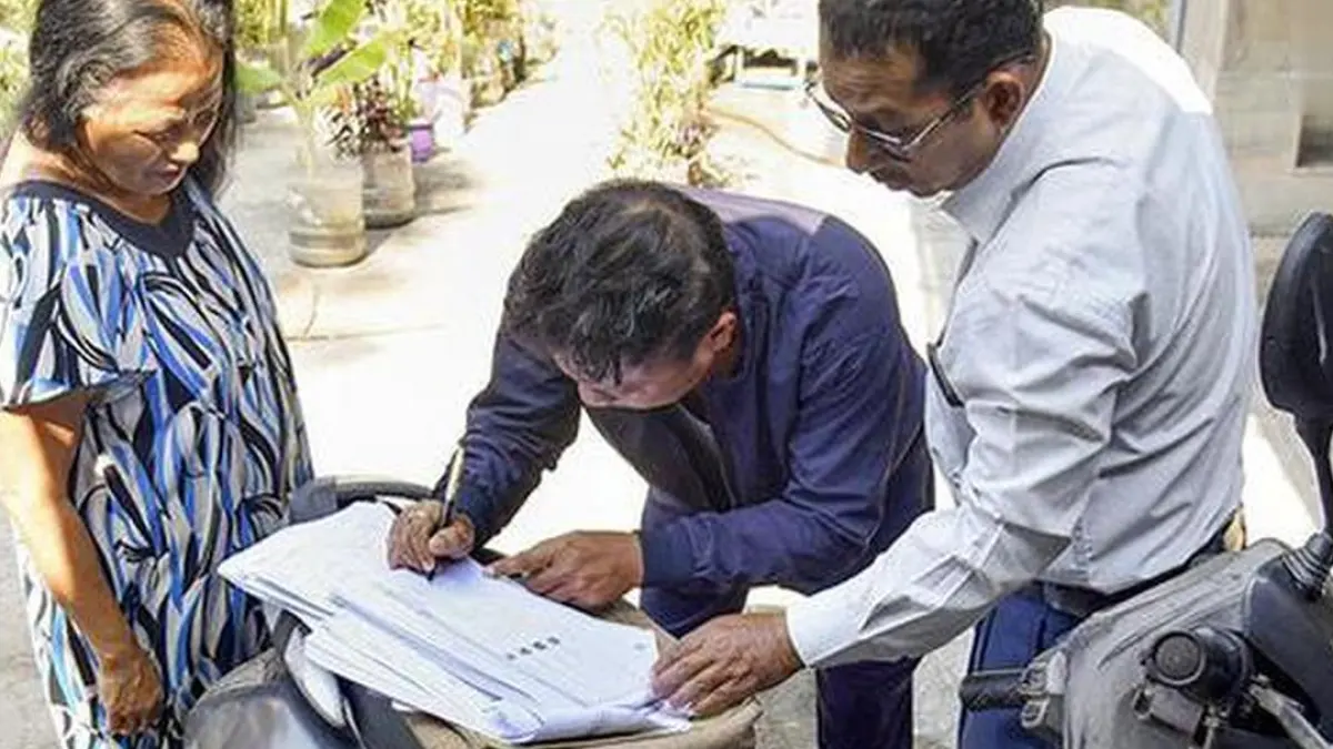 A picture of a person voting in an election