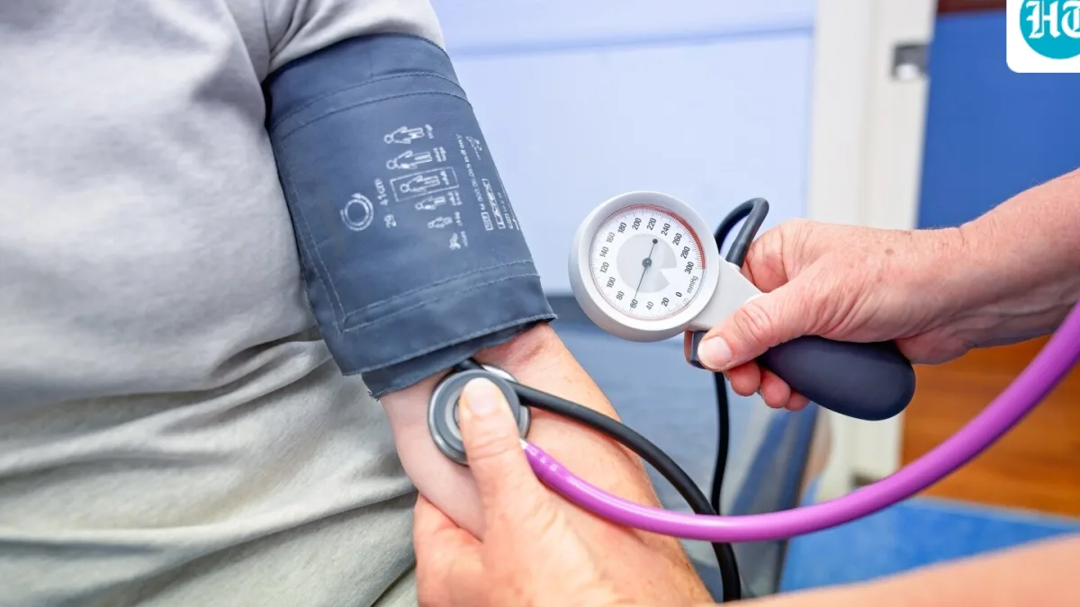 A person using a blood pressure monitor at home