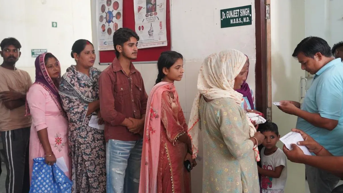A doctor operating a tele-ECG device in a rural health centre