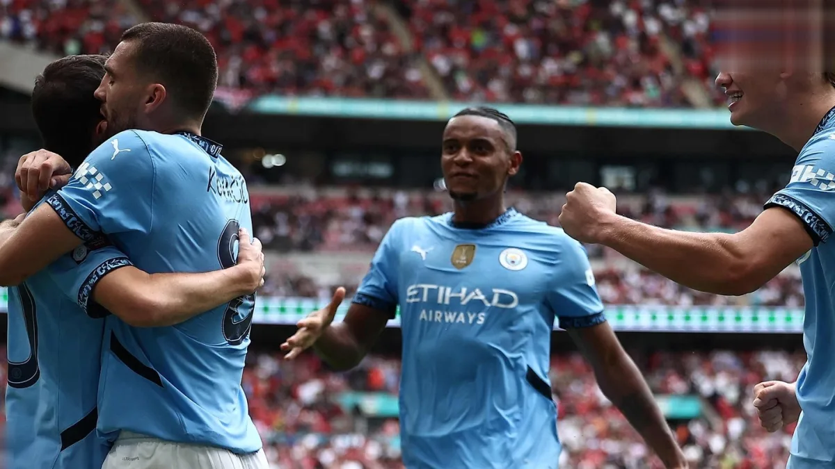 Manchester City players celebrating a goal