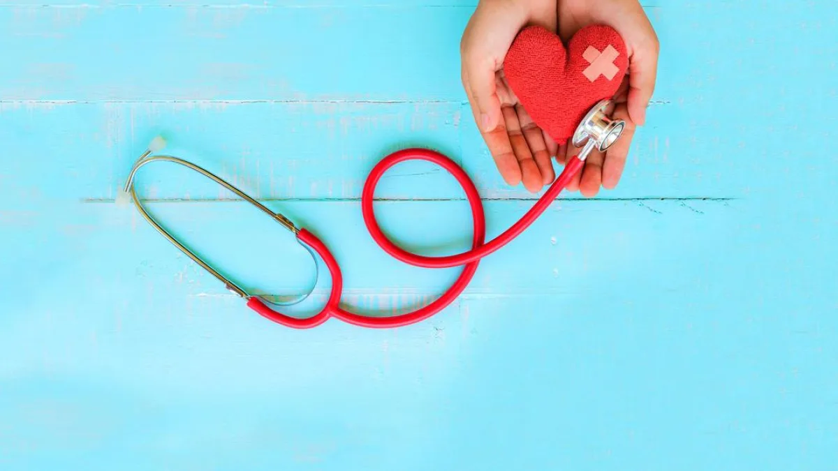 A diagram of the heart with a red arrow pointing to a blocked artery