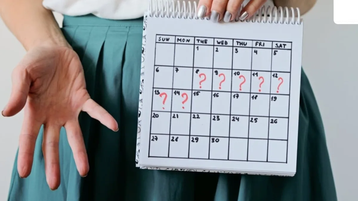 A woman experiencing symptoms of PMOS, with a subtle background of hormonal imbalance