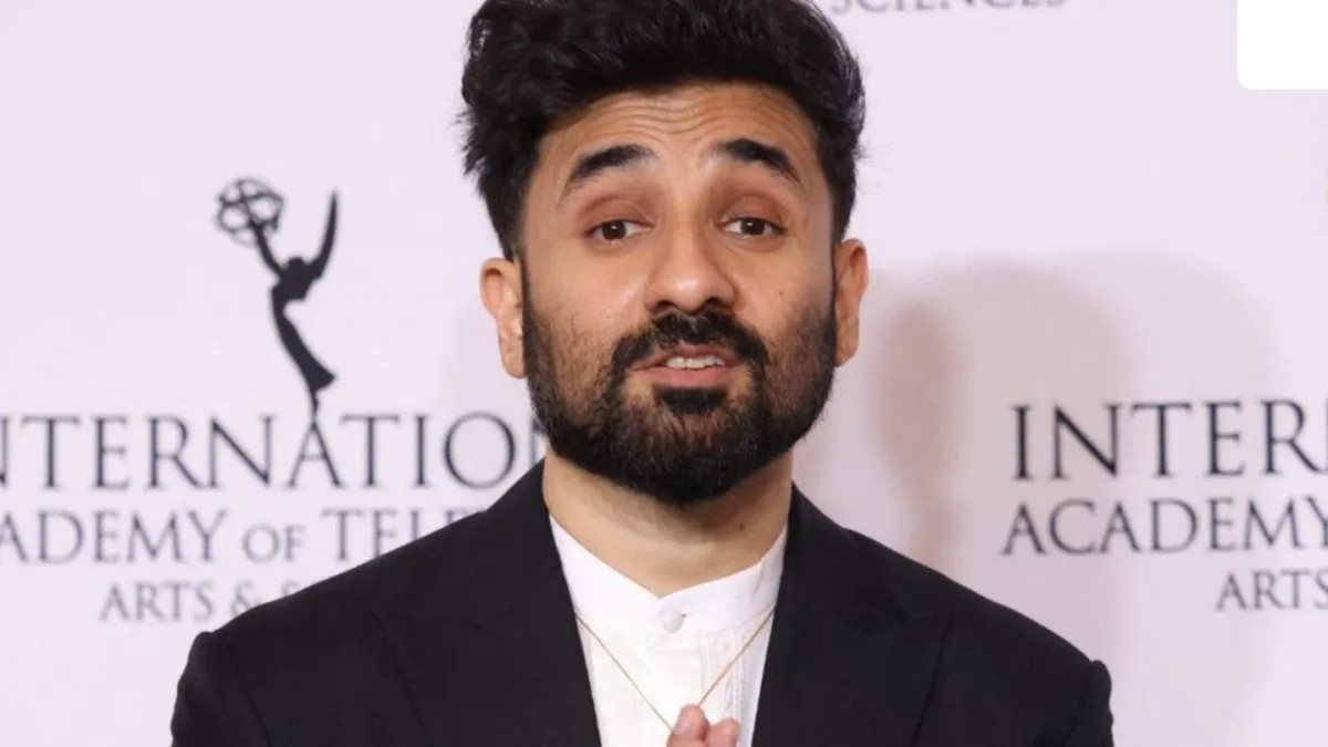 Vir Das holding a microphone on stage