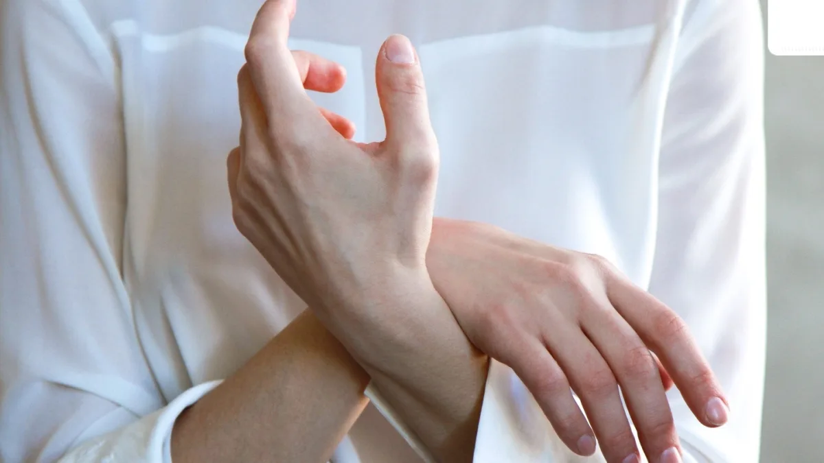 A person looking at their body with a concerned expression