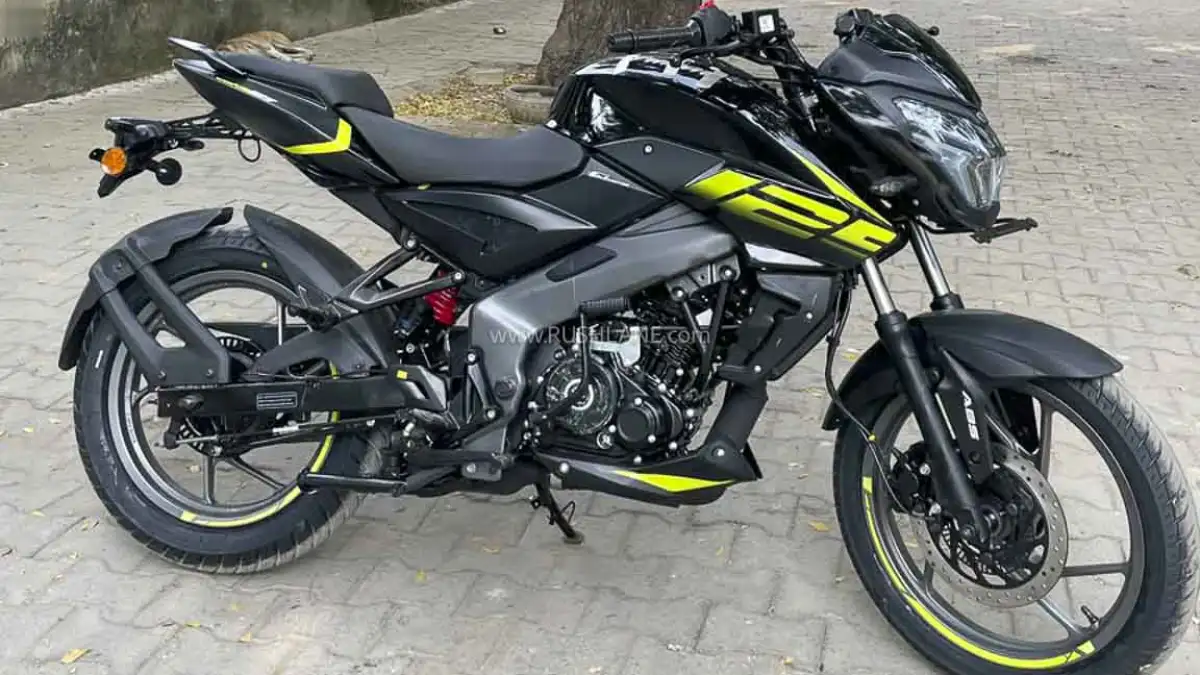 2026 Bajaj Pulsar NS125 motorcycle with glossy black bodywork and fluorescent yellow graphics