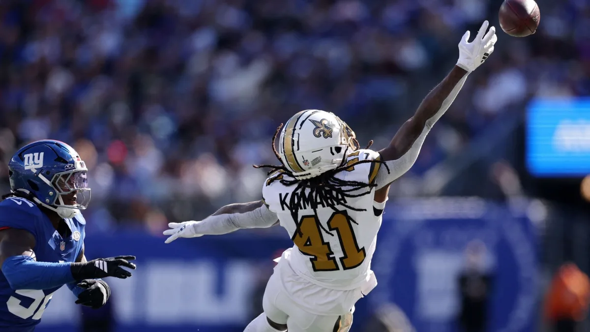Alvin Kamara lying on the ground after a hard fall