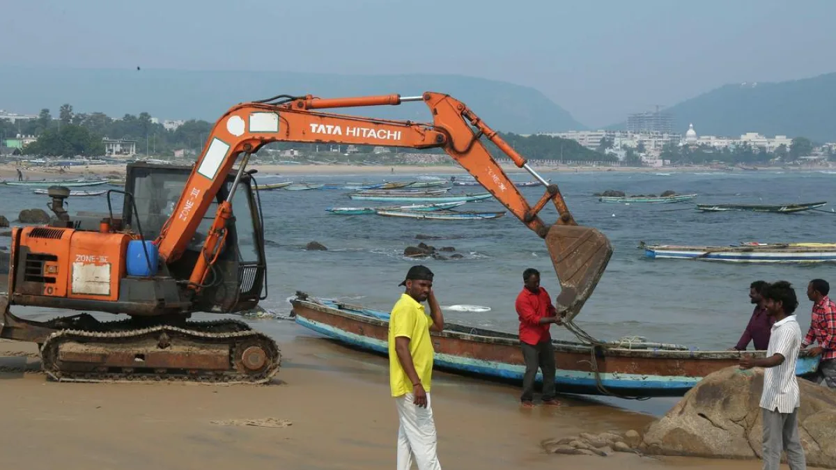 Fishermen hauling a boat ashore in preparation for a cyclone
