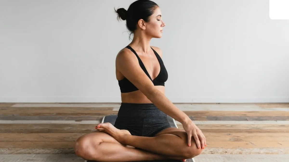 A person practicing yoga in a serene outdoor setting
