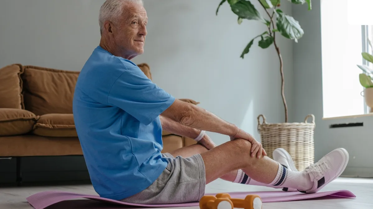 A person with osteoporosis exercising with a healthcare professional
