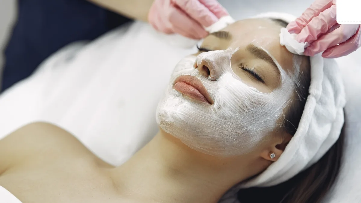 A woman applying skincare products during Karwa Chauth preparations