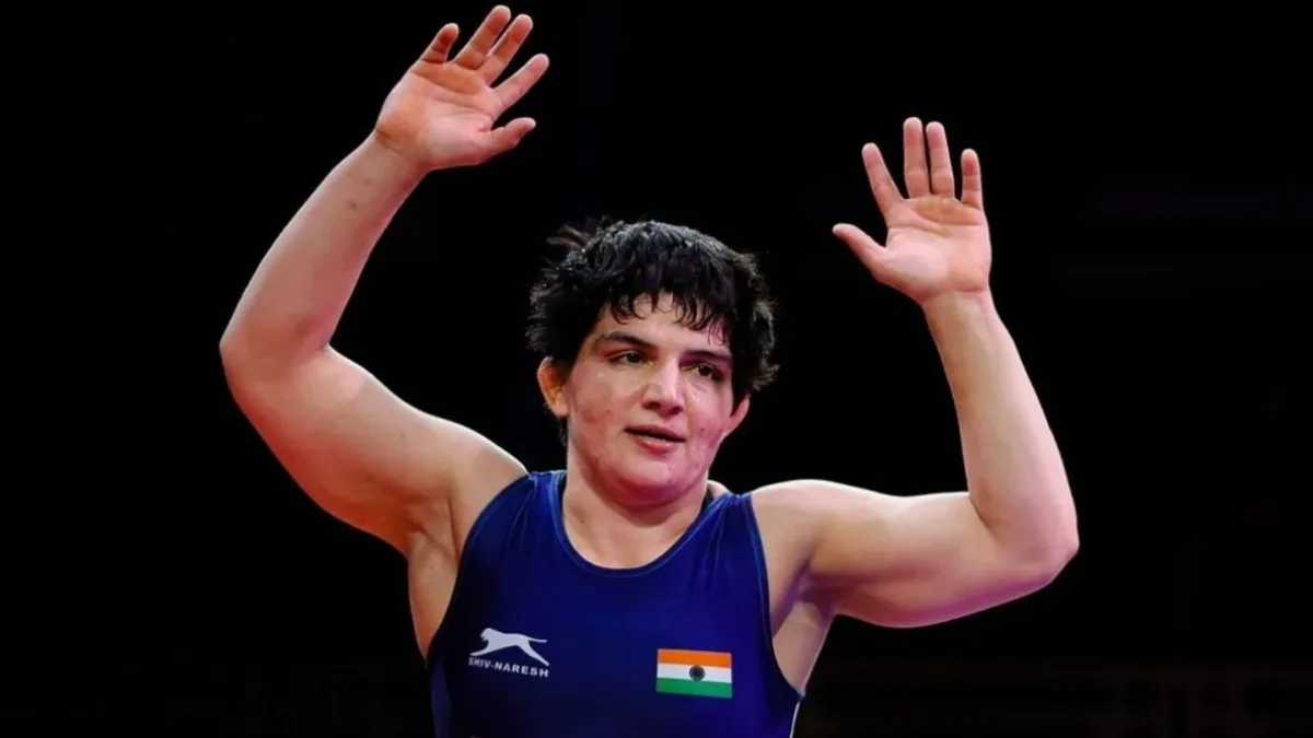 Manisha Bhanwala holding the Indian flag after winning the 59kg category at the World Championships in Astana
