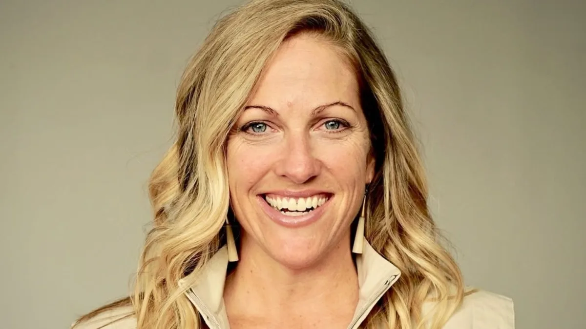 Nicole Noren, a journalist and documentary filmmaker, posing with her awards