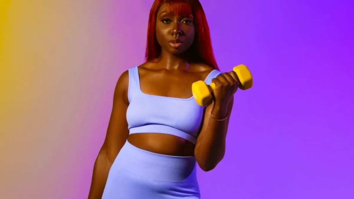 A woman in her 40s doing strength training exercises