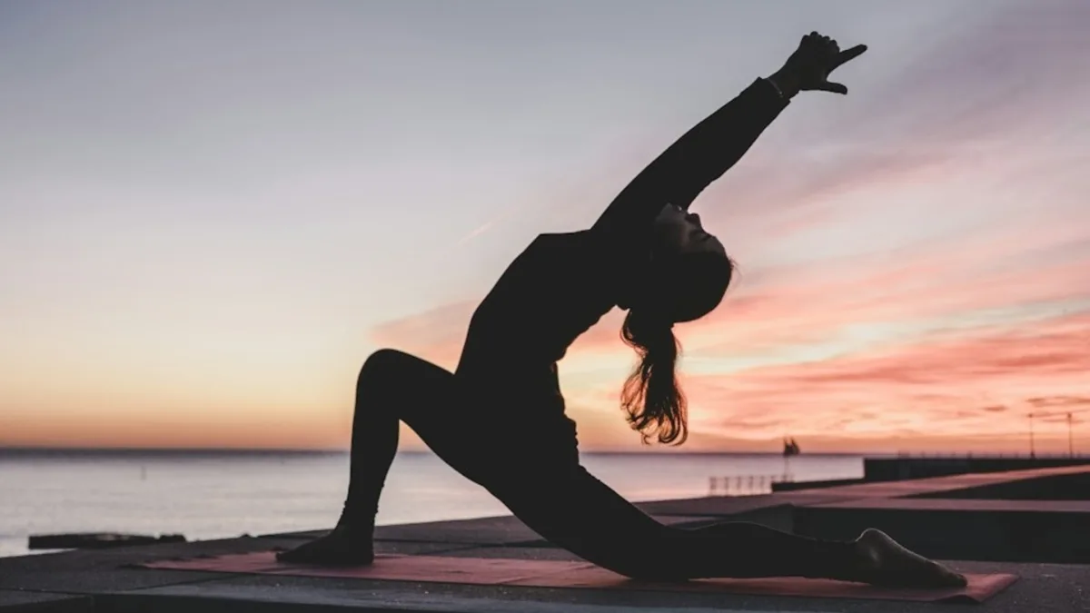 A person practicing yoga in a serene environment