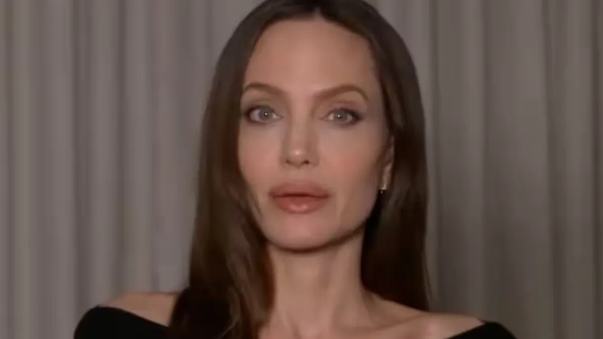 Angelina Jolie smiling, with a quote overlay